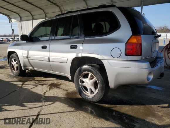 2005 GMC Envoy SLE with VIN 1GKDS13S852374516, listed as a Copart auction lot 42409725 with 299,816 mi miles and Salvage Title. Bid and sale history available at carsss.com. Image 2.