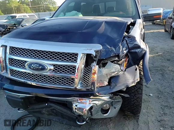 2012 Ford F-150 XL z VIN 1FTFW1ET7CFC68921, wystawiony jako Copart lot #57980135 z przebiegiem 121 407 mil mil oraz Szkoda całkowita • Salvage title. Historia ofert i sprzedaży dostępna na DreamBid. Obrazek 13.