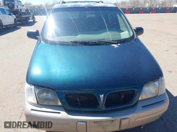 1999 Pontiac Montana with VIN 1GMDX03E0XD166084, listed as a IAAI auction lot 41872976 with 196,027 mi miles and . Bid and sale history available at DreamBid. Image 6.