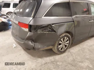2014 Honda Odyssey EX-L with VIN 5FNRL5H67EB056983, listed as a IAAI auction lot 42318699 with 256,267 mi miles and . Bid and sale history available at DreamBid. Image 6.