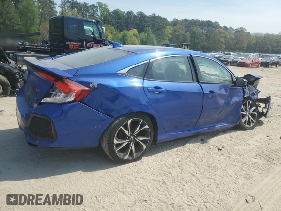 2019 Honda Civic Si with VIN 2HGFC1E52KH702946, listed as a Copart auction lot 53939675 with 64,623 mi miles and Salvage Title. Bid and sale history available at DreamBid. Image 3.