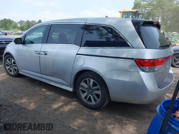 2014 Honda Odyssey Touring with VIN 5FNRL5H97EB054158, listed as a IAAI auction lot 42548360 with 91,161 mi miles and . Bid and sale history available at DreamBid. Image 3.