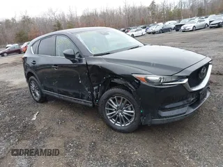2021 Mazda CX-5 Touring with VIN JM3KFBCM8M0338969, listed as a IAAI auction lot 41350715 with 79,345 mi miles. Bid and sale history available at carsss.com. Image 1.