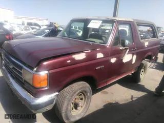 1990 Ford Bronco XL with VIN 1FMEU15N7LLA25223, listed as a IAAI auction lot 41858217 with 196,000 mi miles. Bid and sale history available at carsss.com. Image 2.