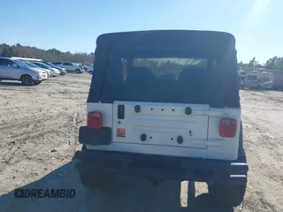 1997 Jeep Wrangler Sport with VIN 1J4FY19S7VP483735, listed as a IAAI auction lot 41469983 with 150,542 mi miles. Bid and sale history available at carsss.com. Image 16.