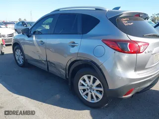 2013 Mazda CX-5 Touring with VIN JM3KE2CE3D0123138, listed as a IAAI auction lot 41818678 with 173,909 mi miles. Bid and sale history available at carsss.com. Image 6.