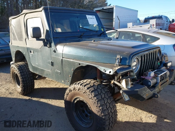 2005 Jeep Wrangler SE with VIN 1J4FA29155P366432, listed as a IAAI auction lot 41260303 with 134,021 mi miles. Bid and sale history available at carsss.com. Image 1.