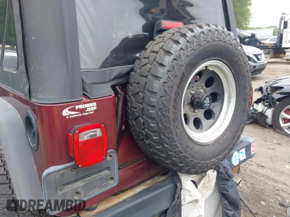 2004 Jeep Wrangler SE with VIN 1J4FA291X4P720783, listed as a IAAI auction lot 42446334 with 69,672 mi miles and . Bid and sale history available at DreamBid. Image 6.