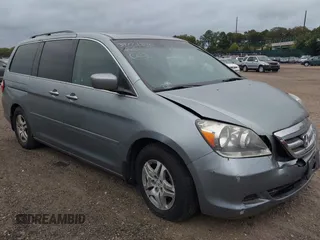 2005 Honda Odyssey EX-L with VIN 5FNRL38625B041067, listed as a IAAI auction lot 40519464 with 117,606 mi miles and . Bid and sale history available at carsss.com. Image 1.