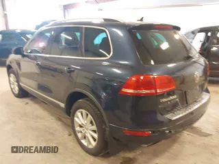 2014 Volkswagen Touareg Sport with VIN WVGEF9BP9ED008967, listed as a IAAI auction lot 41984409 with 193,859 mi miles and . Bid and sale history available at DreamBid. Image 3.