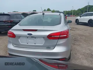 2018 Ford Focus SE z VIN 1FADP3FE4JL214013, wystawiony jako IAAI lot #42180138 z przebiegiem 72 550 mil mil oraz . Historia ofert i sprzedaży dostępna na DreamBid. Obrazek 16.