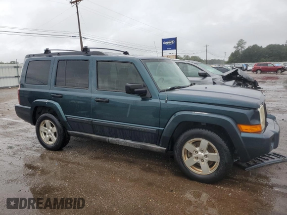 2006 Jeep Commander with VIN 1J8HH48NX6C125803, listed as a Copart auction lot 71247304 with 214,297 mi miles and Salvage Title. Bid and sale history available at carsss.com. Image 4.
