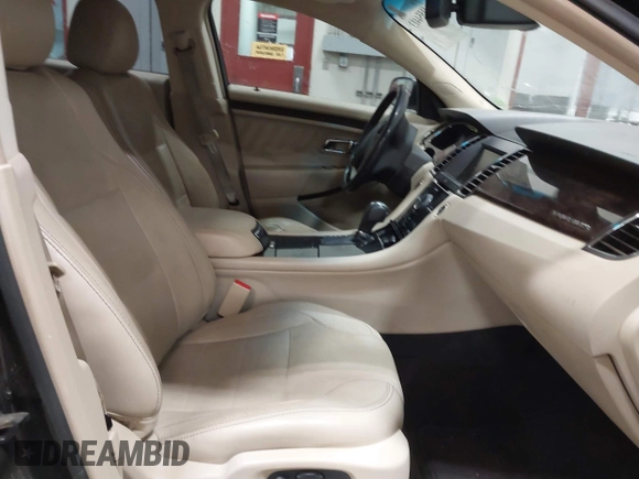2014 Ford Taurus Limited z VIN 1FAHP2J8XEG112565, wystawiony jako IAAI lot #41554413 z przebiegiem 180 870 mil mil oraz . Historia ofert i sprzedaży dostępna na DreamBid. Obrazek 5.