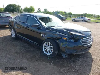 2014 Ford Taurus SE z VIN 1FAHP2D84EG182042, wystawiony jako IAAI lot #41932601 z przebiegiem 77 148 mil mil oraz . Historia ofert i sprzedaży dostępna na DreamBid. Obrazek 1.