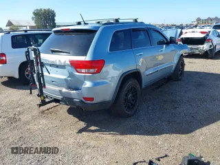 2012 Jeep Grand Cherokee Limited z VIN 1C4RJFBTXCC341813, wystawiony jako IAAI lot #41791662 z przebiegiem 120 811 mil mil oraz . Historia ofert i sprzedaży dostępna na DreamBid. Obrazek 4.
