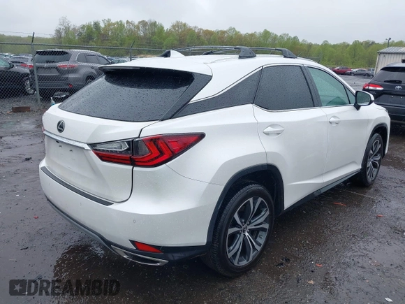 2021 Lexus RX with VIN 2T2HZMDA3MC266624, listed as a IAAI auction lot 42011029 with 27,401 mi miles. Bid and sale history available at carsss.com. Image 4.
