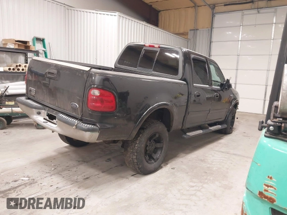 2002 Ford F-150 XLT with VIN 1FTRW08L62KC00490, listed as a IAAI auction lot 41380406 with 192,013 mi miles. Bid and sale history available at carsss.com. Image 4.