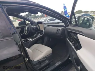 2024 Toyota bZ4X XLE with VIN JTMABACA3RA065683, listed as a IAAI auction lot 40745673 with 1,916 mi miles. Bid and sale history available at carsss.com. Image 5.