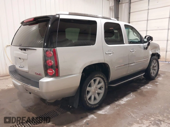 2014 GMC Yukon Denali with VIN 1GKS2EEF0ER134804, listed as a IAAI auction lot 41582709 with 142,192 mi miles. Bid and sale history available at carsss.com. Image 4.