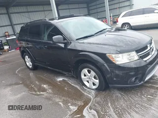 2012 Dodge Journey SXT z VIN 3C4PDDBG9CT297457, wystawiony jako IAAI lot #42202664 z przebiegiem 201 313 mil mil oraz . Historia ofert i sprzedaży dostępna na DreamBid. Obrazek 1.