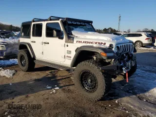 2018 Jeep Wrangler Unlimited Rubicon with VIN 1C4HJXFG8JW104425, listed as a Copart auction lot 87545965 with 62,988 mi miles and Salvage title. Bid and sale history available at DreamBid. Image 4.
