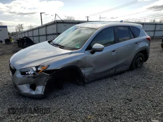 2014 Mazda CX-5 Touring with VIN JM3KE4CY4E0427294, listed as a Copart auction lot 51372155 with 121,324 mi miles and Salvage Title. Bid and sale history available at carsss.com. Image 1.