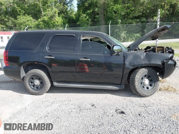 2013 Chevrolet Tahoe Commercial with VIN 1GNLC2E00DR265941, listed as a IAAI auction lot 42289977 with 206,840 mi miles and . Bid and sale history available at DreamBid. Image 12.