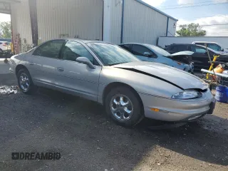 1997 Oldsmobile Aurora with VIN 1G3GR62C0V4102252, listed as a Copart auction lot 53270245 with 123,615 mi miles and Salvage Title. Bid and sale history available at DreamBid. Image 4.