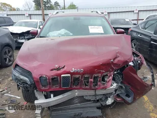 2019 Jeep Cherokee Latitude Plus with VIN 1C4PJLLB9KD434990, listed as a IAAI auction lot 41959477 with 96,283 mi miles and . Bid and sale history available at DreamBid. Image 12.