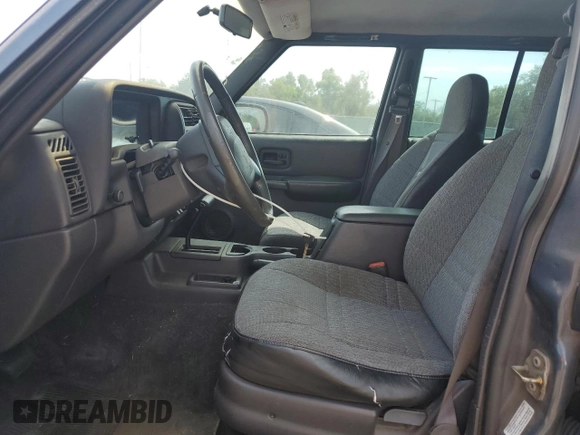 2001 Jeep Cherokee Sport with VIN 1J4FT48S31L596648, listed as a Copart auction lot 54101345 with 190,688 mi miles and Clean title. Bid and sale history available at DreamBid. Image 7.