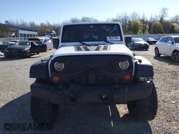 2012 Jeep Wrangler Unlimited Sport with VIN 1C4BJWDG2CL257437, listed as a Copart auction lot 49257965 with 141,695 mi miles and Clean title. Bid and sale history available at DreamBid. Image 5.