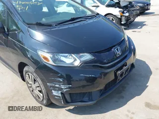 2015 Honda Fit LX z VIN 3HGGK5H51FM724566, wystawiony jako IAAI lot #42151755 z przebiegiem 168 744 mil mil oraz . Historia ofert i sprzedaży dostępna na DreamBid. Obrazek 6.