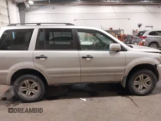 2005 Honda Pilot EX-L with VIN 2HKYF18575H557005, listed as a IAAI auction lot 41647830 with 245,992 mi miles. Bid and sale history available at carsss.com. Image 13.