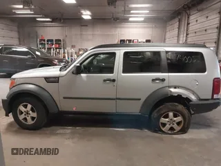 2007 Dodge Nitro SXT with VIN 1D8GU28K47W569317, listed as a IAAI auction lot 41740052 with 220,265 mi miles. Bid and sale history available at carsss.com. Image 14.