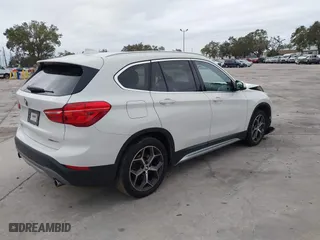 2018 BMW X1 xDrive28i with VIN WBXHT3C37J3H33461, listed as a IAAI auction lot 40997589 with 1 mi miles. Bid and sale history available at carsss.com. Image 4.