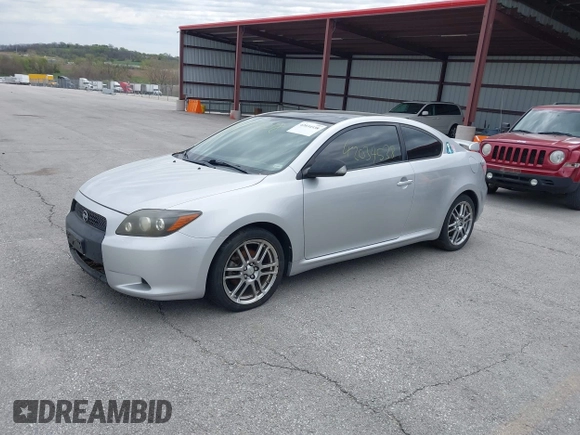 2009 Scion tC with VIN JTKDE167190282930, listed as a IAAI auction lot 42034538 with 198,964 mi miles. Bid and sale history available at carsss.com. Image 2.