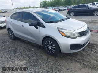 2015 Kia Rio LX with VIN KNADM4A32F6500489, listed as a IAAI auction lot 41943956 with 195,493 mi miles. Bid and sale history available at carsss.com. Image 1.