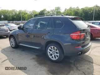 2012 BMW X5 35i with VIN 5UXZV4C59CL752661, listed as a Copart auction lot 58590305 with 101,725 mi miles and Salvage title. Bid and sale history available at DreamBid. Image 2.