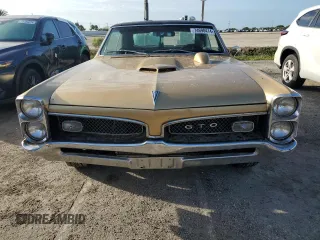 1967 Pontiac GTO z VIN 242177P108834, wystawiony jako Copart lot #74698414 z przebiegiem 230 374 mil mil oraz Szkoda całkowita • Salvage title. Historia ofert i sprzedaży dostępna na DreamBid. Obrazek 5.