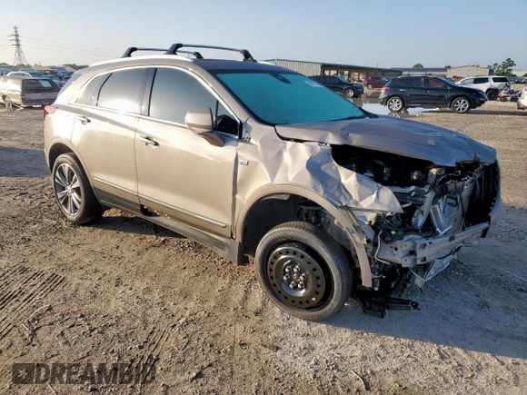 2022 Cadillac XT5 Premium Luxury FWD z VIN 1GYKNERS9NZ120517, wystawiony jako Copart lot #58978045 z przebiegiem 31 456 mil mil oraz Szkoda całkowita • Salvage title. Historia ofert i sprzedaży dostępna na DreamBid. Obrazek 4.