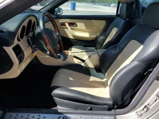 2003 Mercedes-Benz SLK 320 with VIN WDBKK65F03F286130, listed as a Copart auction lot 61544385 with 98,899 mi miles and Salvage title. Bid and sale history available at DreamBid. Image 7.