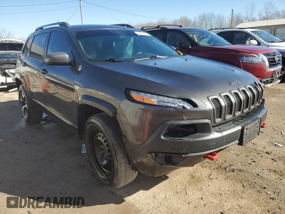 2014 Jeep Cherokee Trailhawk with VIN 1C4PJMBS1EW161642, listed as a Copart auction lot 46672345 with 196,908 mi miles and Salvage Title. Bid and sale history available at carsss.com. Image 4.