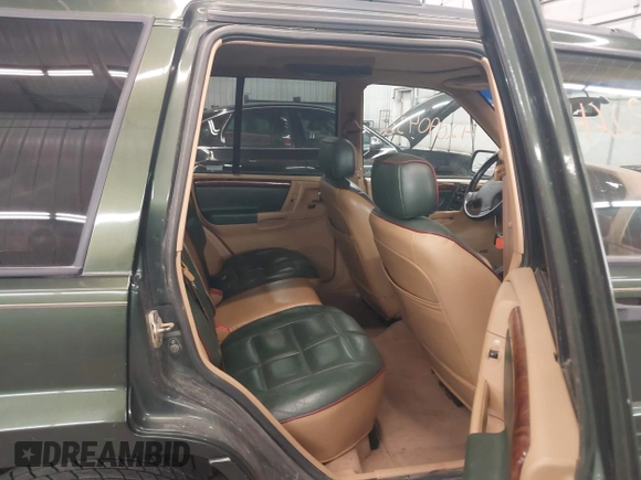 1997 Jeep Grand Cherokee Limited with VIN 1J4GZ78Y0VC684023, listed as a IAAI auction lot 42090436 with 310,831 mi miles. Bid and sale history available at carsss.com. Image 8.