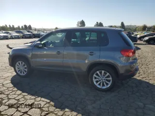 2014 Volkswagen Tiguan SEL with VIN WVGAV3AX8EW585929, listed as a Copart auction lot 61462205 with 63,899 mi miles and Salvage title. Bid and sale history available at DreamBid. Image 2.