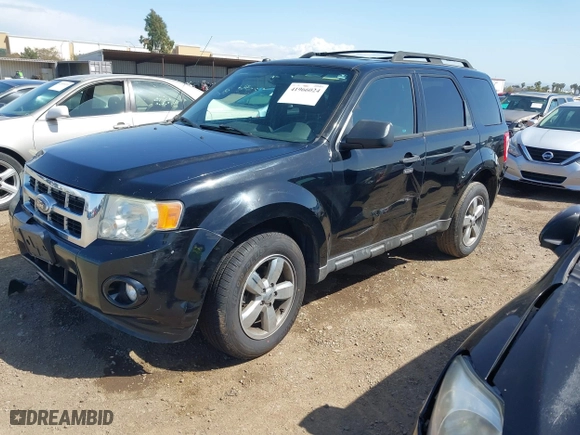 2010 Ford Escape XLT with VIN 1FMCU0DG6AKB52973, listed as a IAAI auction lot 41966024 with 137,774 mi miles. Bid and sale history available at carsss.com. Image 2.