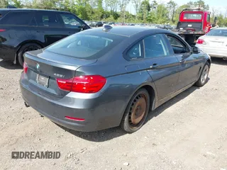 2015 BMW 4 Series 428i xDrive with VIN WBA4C9C55FD331921, listed as a IAAI auction lot 42214901 with 94,970 mi miles and . Bid and sale history available at DreamBid. Image 4.