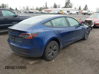 2023 Tesla Model 3 Long Range with VIN 5YJ3E1EB5PF704463, listed as a IAAI auction lot 41916627 with 14,305 mi miles and . Bid and sale history available at DreamBid. Image 4.
