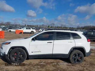 2015 Jeep Cherokee North with VIN 1C4PJMCS7FW792850, listed as a IAAI auction lot 41323432 with 102,642 mi miles. Bid and sale history available at carsss.com. Image 14.