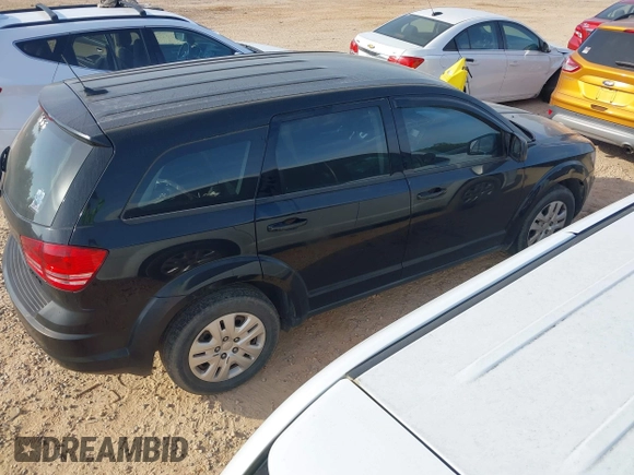2014 Dodge Journey SE with VIN 3C4PDCAB7ET170340, listed as a IAAI auction lot 42078834 with 215,084 mi miles and . Bid and sale history available at carsss.com. Image 4.