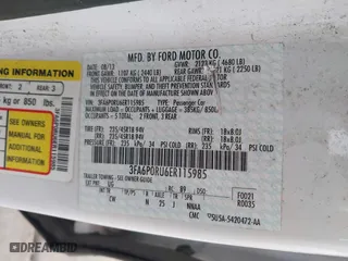 2014 Ford Fusion Titanium Hybrid with VIN 3FA6P0RU6ER115985, listed as a IAAI auction lot 41870494 with 132,321 mi miles. Bid and sale history available at carsss.com. Image 9.